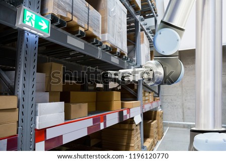 Roboric arm in warehouse
