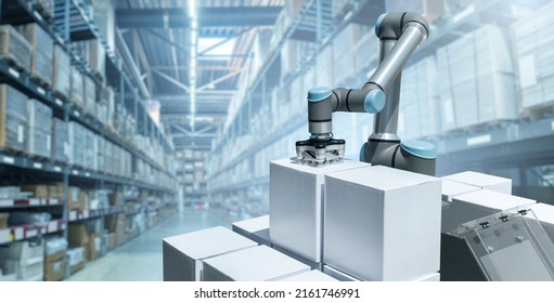 Robot Arm Moves Boxes In An Automatic Warehouse. Concept