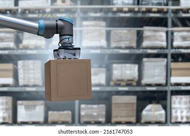 Robot Arm Moves Boxes In An Automatic Warehouse. Concept