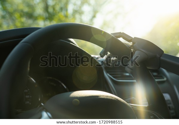 Robot arm on a steering\
wheel. Artificial intelligence drives a car. Autonomous vehicle\
concept.