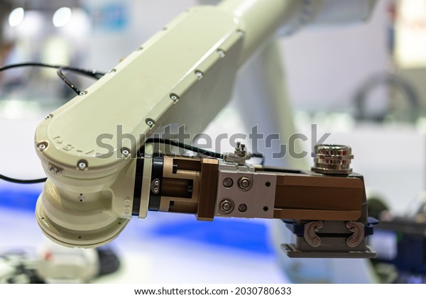 robot arm working in\
factory