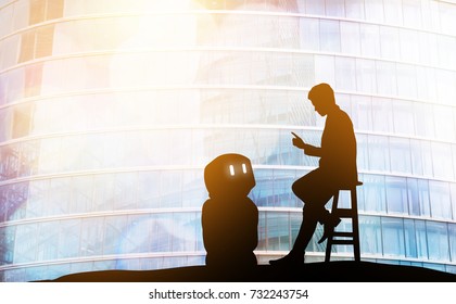 Robot Assistant Technology , Industry 4.0 , Artificial Intelligence Trend Concept. Silhouette Of Business Man Talking To Automation Robo Advisor. Bokeh Flare Light Effect With Building Background.