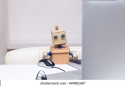 The Robot Is Busy Working On The Computer