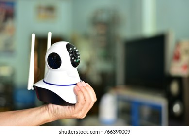 robot camera cctv for security home on hand blurred background.