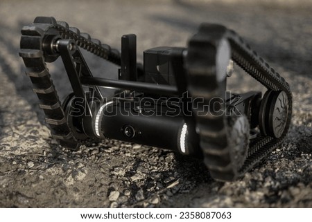 a robot designed to work with hazardous materials in difficult conditions. Its ability to move on gravel for use in a variety of applications.