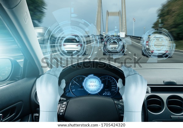 The robot drives a\
car. Autonomous driving