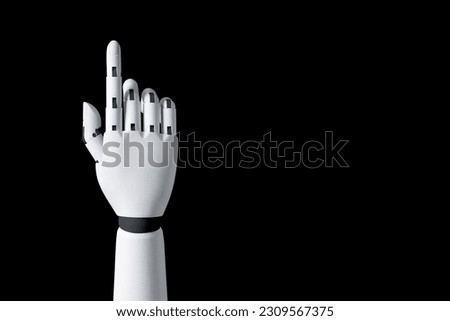 Robot hand finger making contact or pressing something on dark isolated background. Cyborg mechanical arm pointing. artificial Intelligence futuristic design concept.