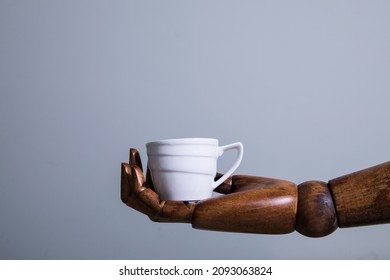 Robot Hand Holding Coffee Cup. Good Morning. Coffee