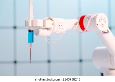 Robot Hand With A Medical Syringe. Future Medicine Concept Using Robots And Artificial Intelligence