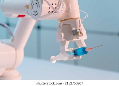 Robot Hand With A Medical Syringe. Future Medicine Concept Using Robots And Artificial Intelligence