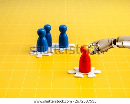 Robot hand selecting red human figure among blue ones on puzzle base over yellow grid background, symbolizing AI recruitment, talent selection, HR automation, and smart data-driven hiring processes.