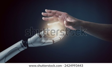 Robot hand touch human hand, the concept of using artificial intelligence technology or Machine learning, learning of AI together with humans, Communication and chat with AI to develop innovation.