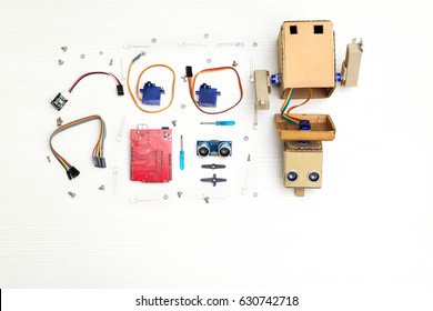 Robot With Hands And Robotics Parts And Elements.