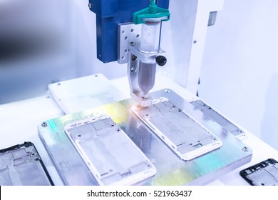 Robot holding glue syringe Injection on phone