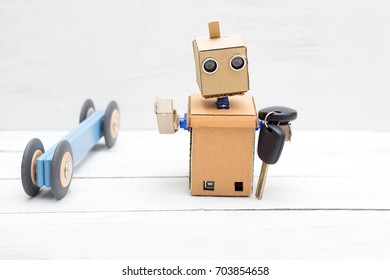 The Robot Holds The Car Keys In His Hand. Robot Driver.