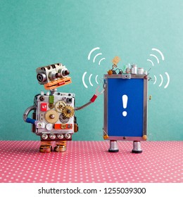 Robot Looks At A Smartphone With Beep Sound And Exclamation Mark On Blue Screen. Attention And Help Service Concept. Blue Red Background.