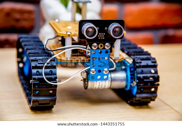 Robot on Wheels, managed by Computer,\
original custom hot rod style automobile with unique design and\
stylized environment with soft focus\
background