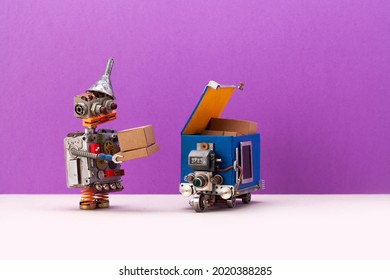 Robot Received The Order Using An Autonomous Robotics Parcel Delivery Service Courier Truck. Purple Gray Background