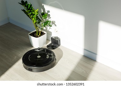 Robot Vacuum Cleaner To Pick Up Dirt Prepared A Wooden Floor