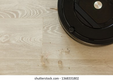 Robot Vacuum Cleaner To Pick Up Dirt Prepared A Wooden Floor