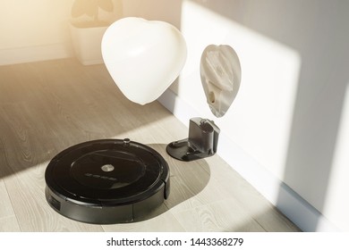 Robot Vacuum Cleaner To Pick Up Dirt Prepared A Wooden Floor