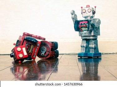 robot wars red robot defeated on old wooden floor
