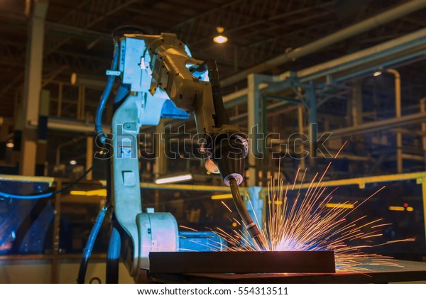 Robot is welding assembly automotive part in\
production line