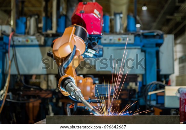 Robot welding is welding assembly automotive part\
in  factory