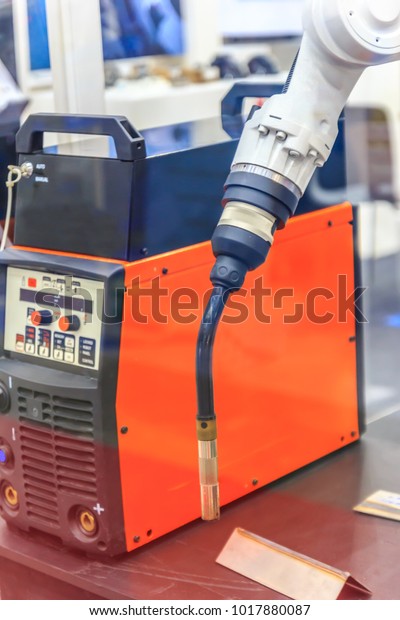 Robot\
and welding machine used for automotive\
industry\
