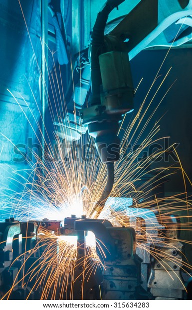 Robot welding movement Industrial  automotive
part in factory
