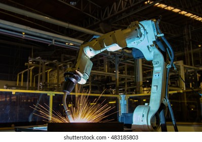 Robot Welding  Part In Automotive Factory
