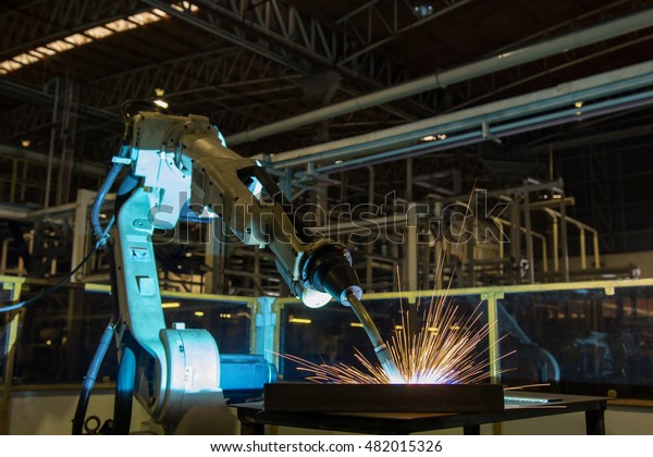 Robot\
welding test run program in automotive\
factory\
