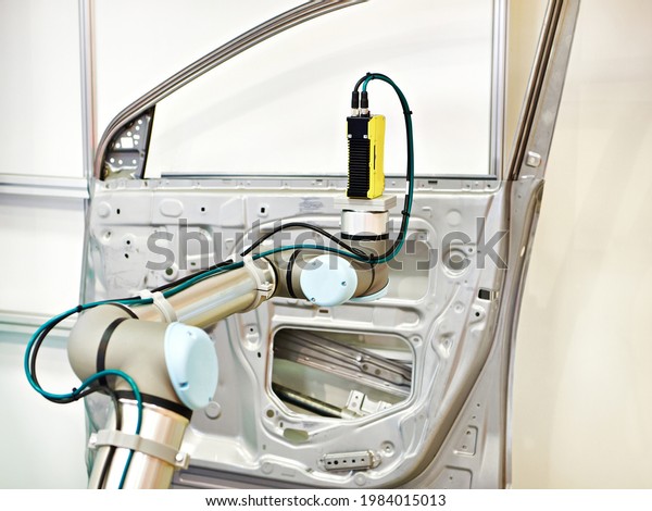 Robotic arm with 3D vision systems car door\
automotive industry