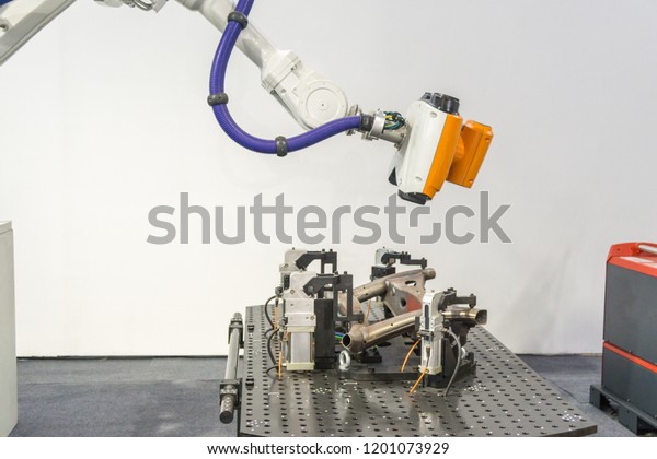 robotic arm at\
industrial manufacture\
factory