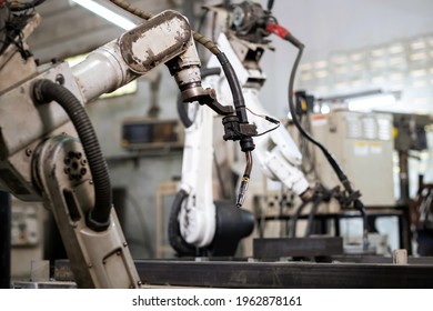 Robotic Arm Machine In The Factory For Welding Metal. Automation System In Factory. No People. Technology And Industrial From Ai Concept