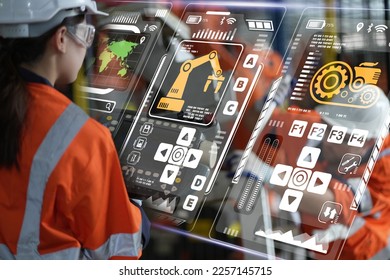 robotic arms. Engineer manager checking and controling automation robot arms machine in intelligent factory industrial on real time monitoring system software. digital manufacturing operation.
