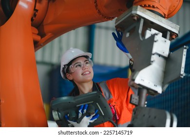 robotic arms. Engineer manager checking and controling automation robot arms machine in intelligent factory industrial on real time monitoring system software. digital manufacturing operation.
