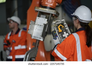 robotic arms. Engineer manager checking and controling automation robot arms machine in intelligent factory industrial on real time monitoring system software. digital manufacturing operation.