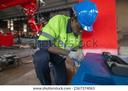 A robotic engineer performs maintenance and inspects electrical systems for appropriate wiring, polarity, grounding, termination reliability. Following and adhering to safety protocols and procedures