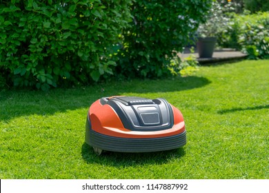 Robotic Lawn Mower On Grass