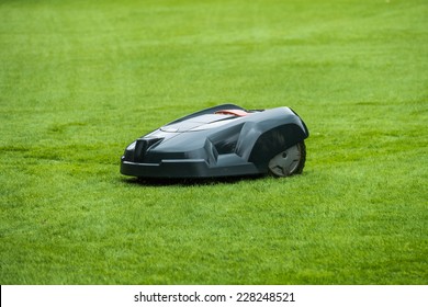 Robotic Lawn Mower On Grass, Side View