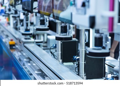 Robotic machine vision system in phone factory - Shutterstock ID 518713594
