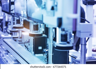 Robotic machine vision system in phone factory - Shutterstock ID 677264371