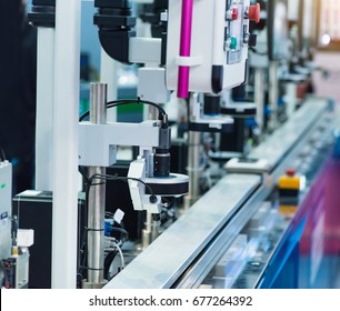 Robotic machine vision system in phone factory - Shutterstock ID 677264392