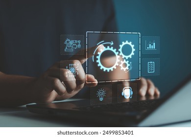 Robotic process automation concept, RPA, artificial intelligence. Man use laptop with virtual automation technology to automate business tasks with AI. Digital transformation and change management.