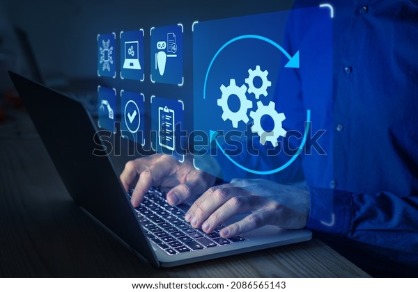 Robotic Process Automation (RPA) technology\
to automate business tasks with AI. Concept with expert setting up\
automated software on laptop computer. Digital transformation and\
change management.