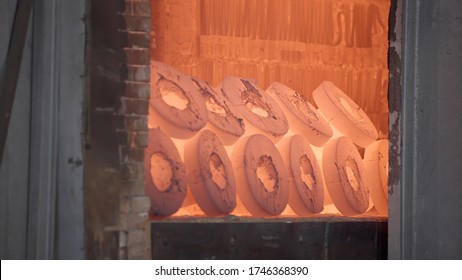 Robotic Retractable Furnace With Red Hot Metal Workpieces In Foundry. Room For Manufacture Of Metal Products By Casting. Casting Shop For Gassified Models. Blast Furnace Steel Production Steel Works.