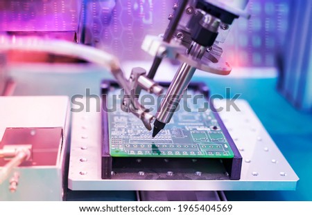 robotic soldering iron tips of system for automatic point soldering for printed and assembly electric circuit board ( PCB ) at factory

