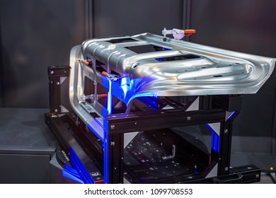 Robotic system 3d scan. A complex metal part is scanned by light rays.