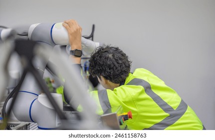 Robotic trainees learn operating, programming, troubleshooting, and quality control through practical workshops and demonstrations of robotic arms and systems in the manufacturing training academy.